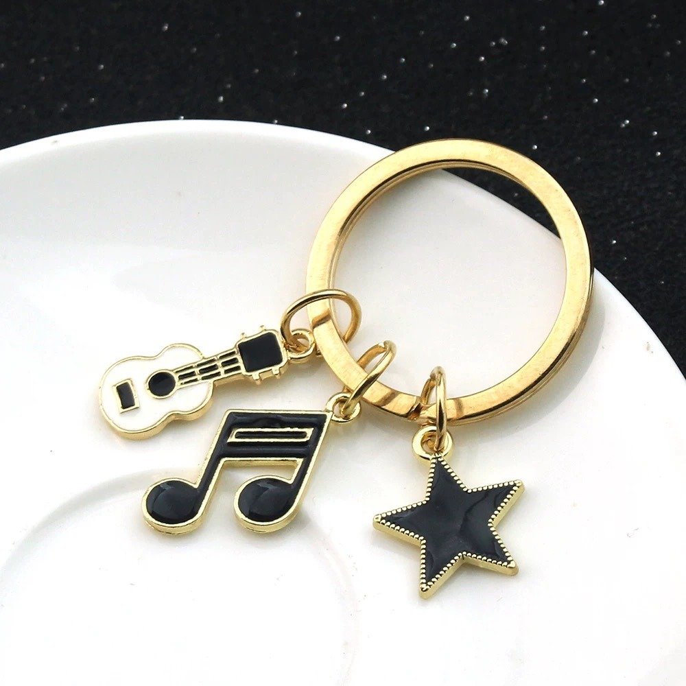 IMG_1045.jpeg Music Notes Metal Charm Keychain - Image 1