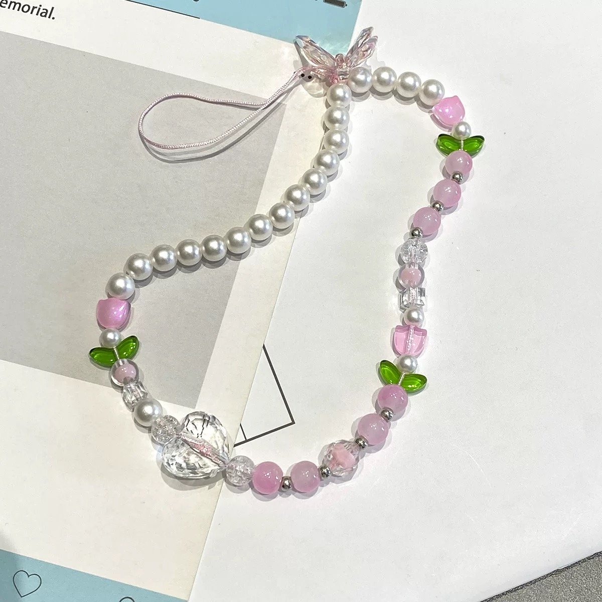 IMG_8468.jpeg Pink Tulip Butterfly Glass bead Phone Charm - Image 1