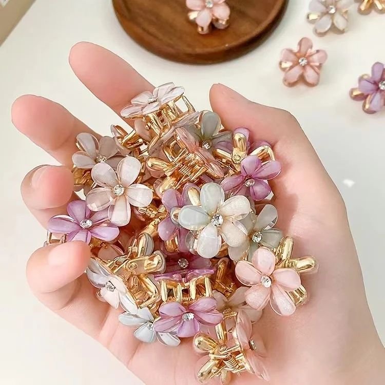Mini-Flower-Hair-Clips-Size-2cmMaterial-CrystalSet-6pcs6colourPrice-90Tk.webp.jpg Mini Flower Hair Clips - Image 1